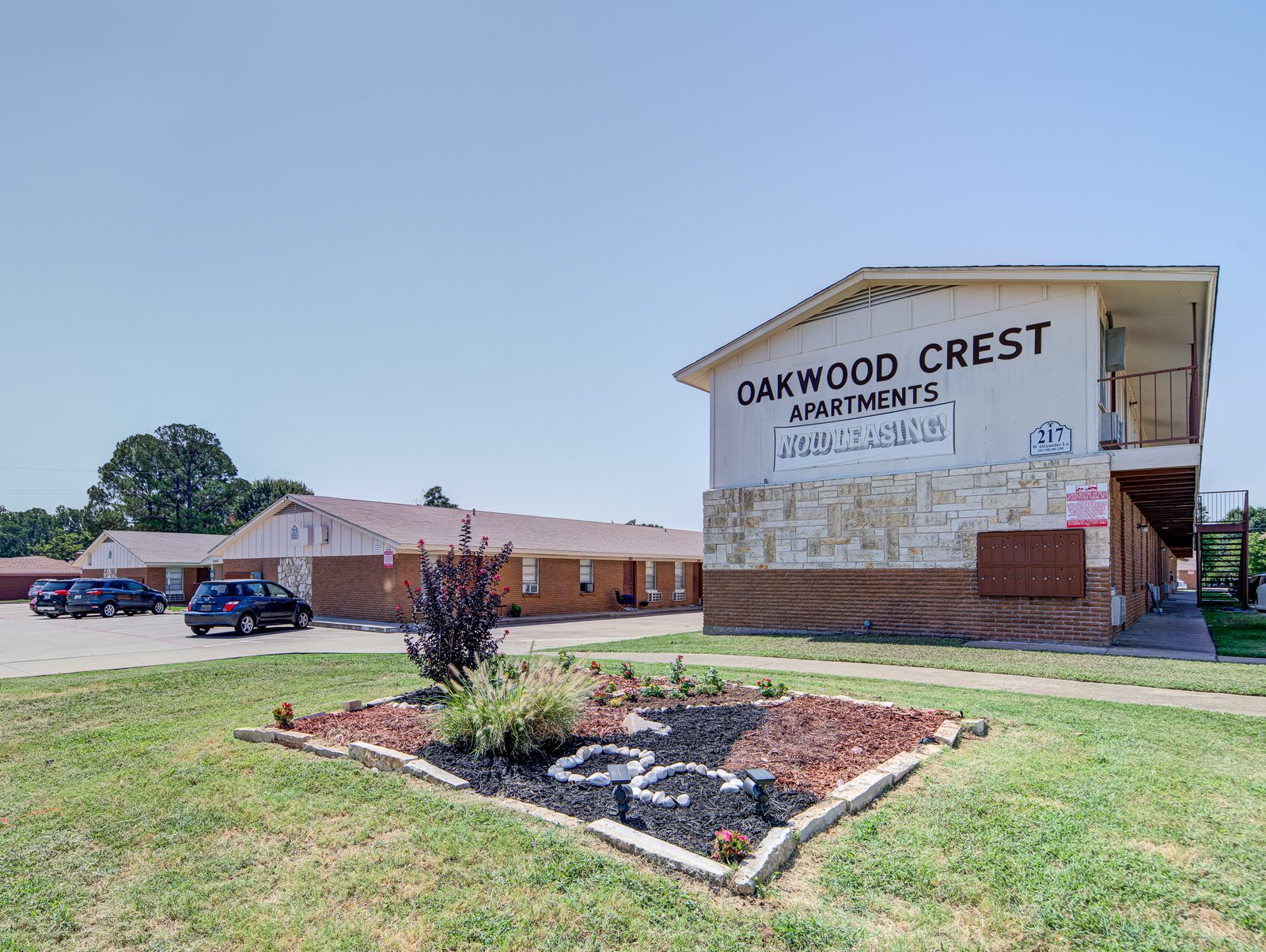 Oakwood Crest Apartments sign and leasing office in Euless, TX